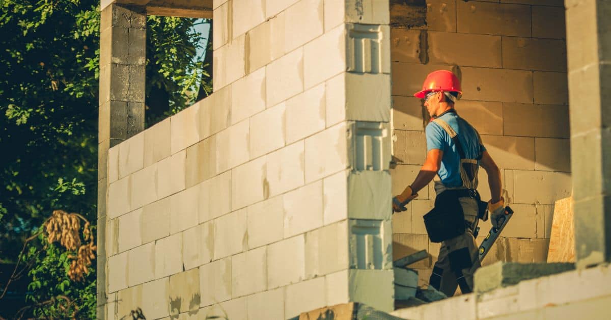 Builder Walking in Construction Site