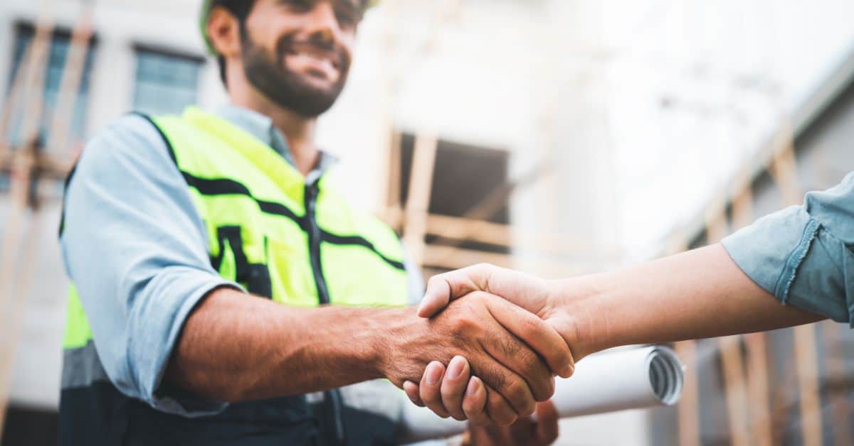 Construction Man shaking hands with client
