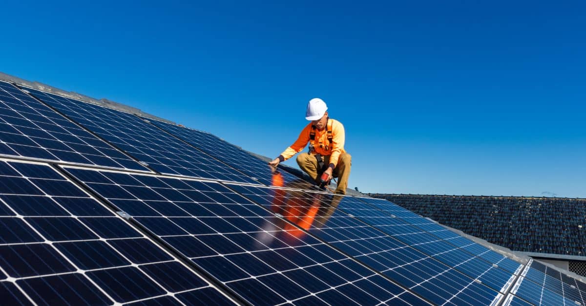 Man installing solar powers on the roof