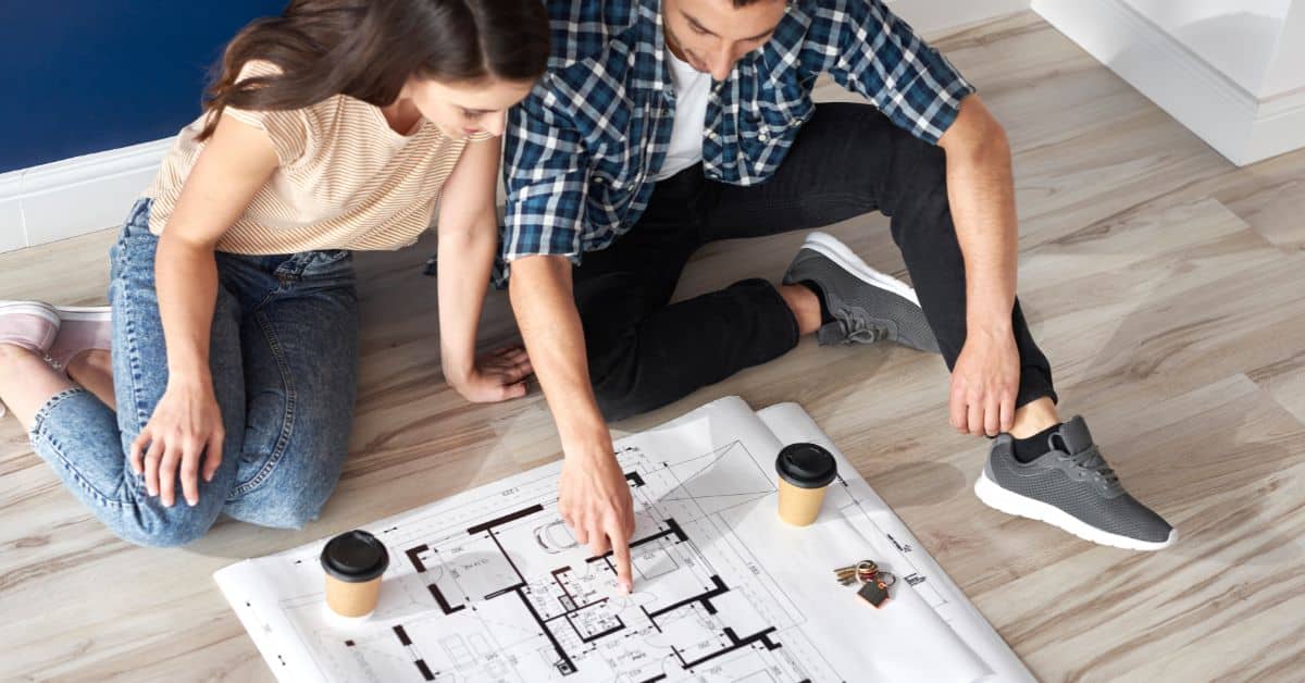 Couple going through house plans