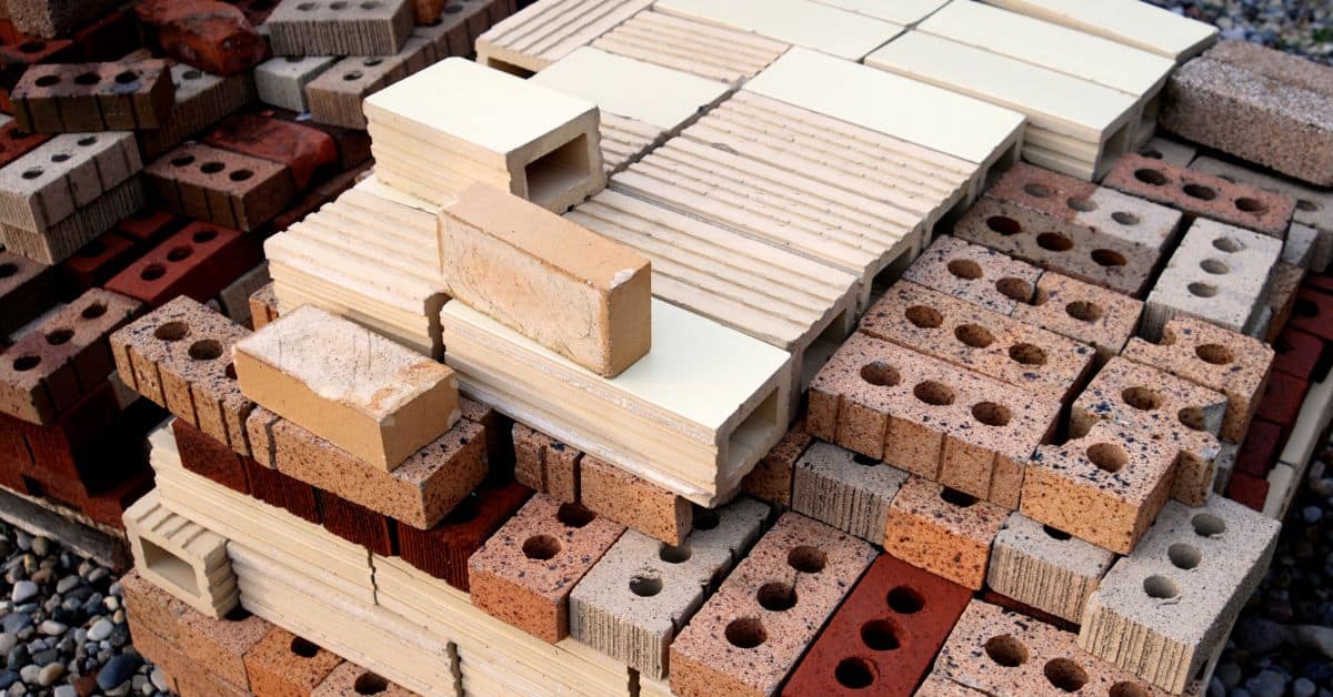 Various affordable bricks for budget-friendly house construction in South Africa.