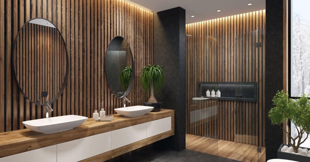 Modern bathroom vanity featuring two vessel sinks, large mirrors, and wooden wall paneling for a sle.