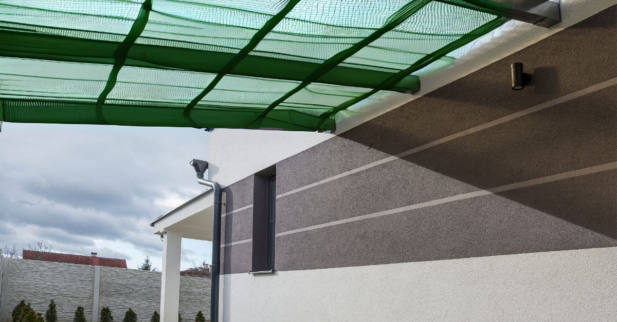 Durable green carport shielding vehicles from Cape Town’s weather conditions.