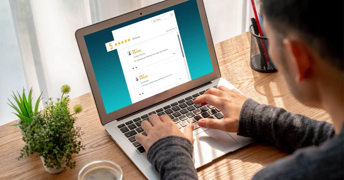 Person looking at online reviews on his laptop