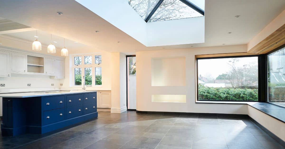 Bright interior of a single storey house with large windows and skylight in South Africa.