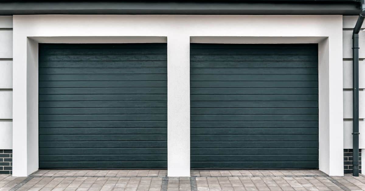 Double garage doors with sleek black panels for modern home design.