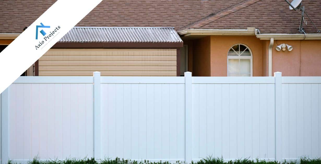Fence installation with a white boundary wall in a residential area in Cape Town.