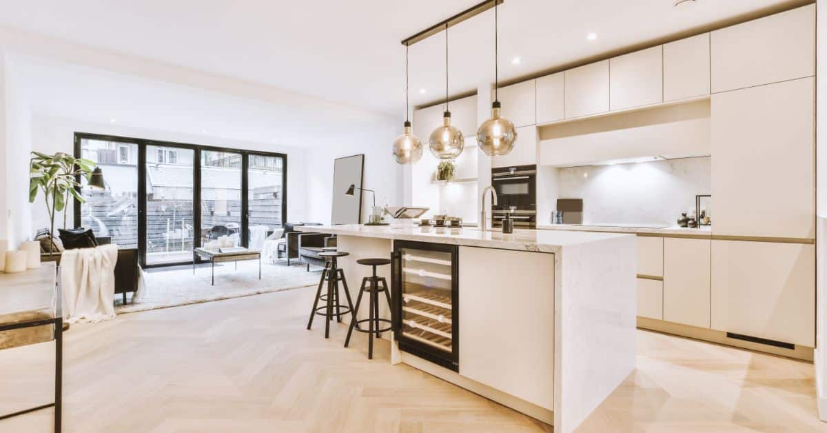 Elegant kitchen design with white cabinetry and a spacious layout.
