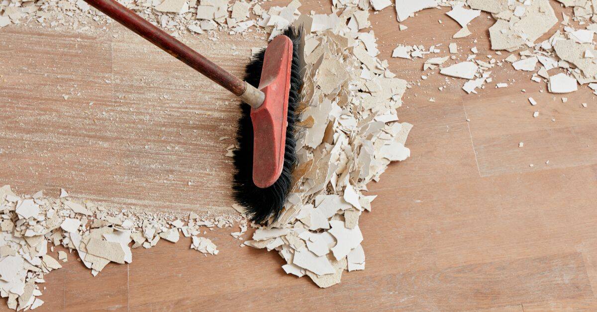 Cleaning up debris with a broom