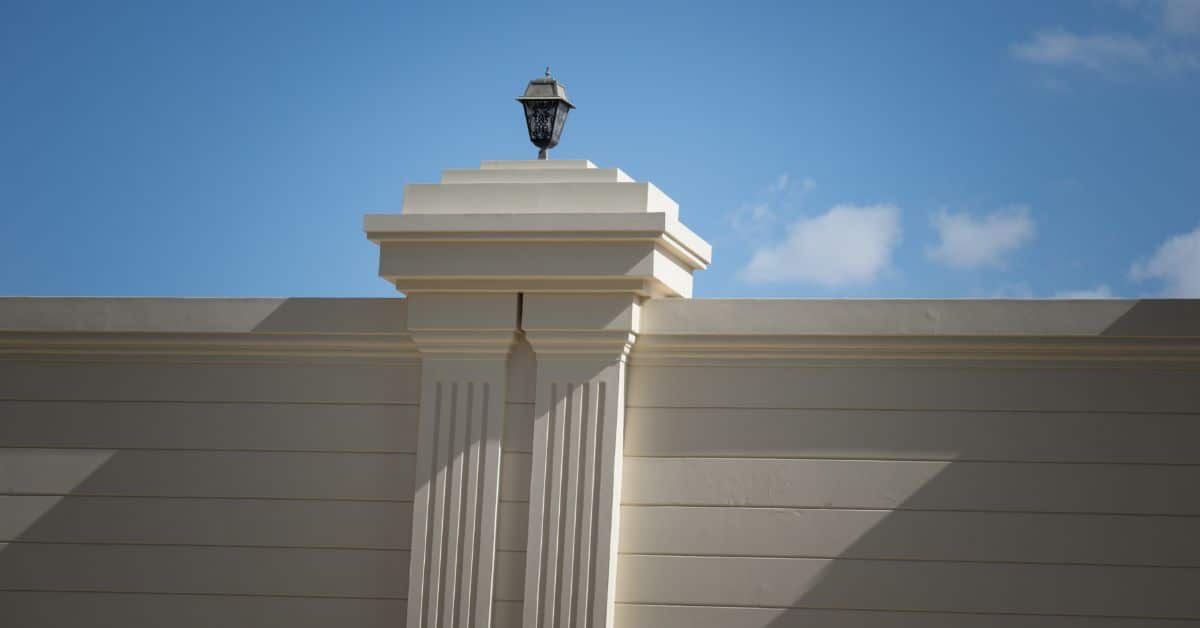 Elegant boundary wall with decorative pillar and lantern in Cape Town.