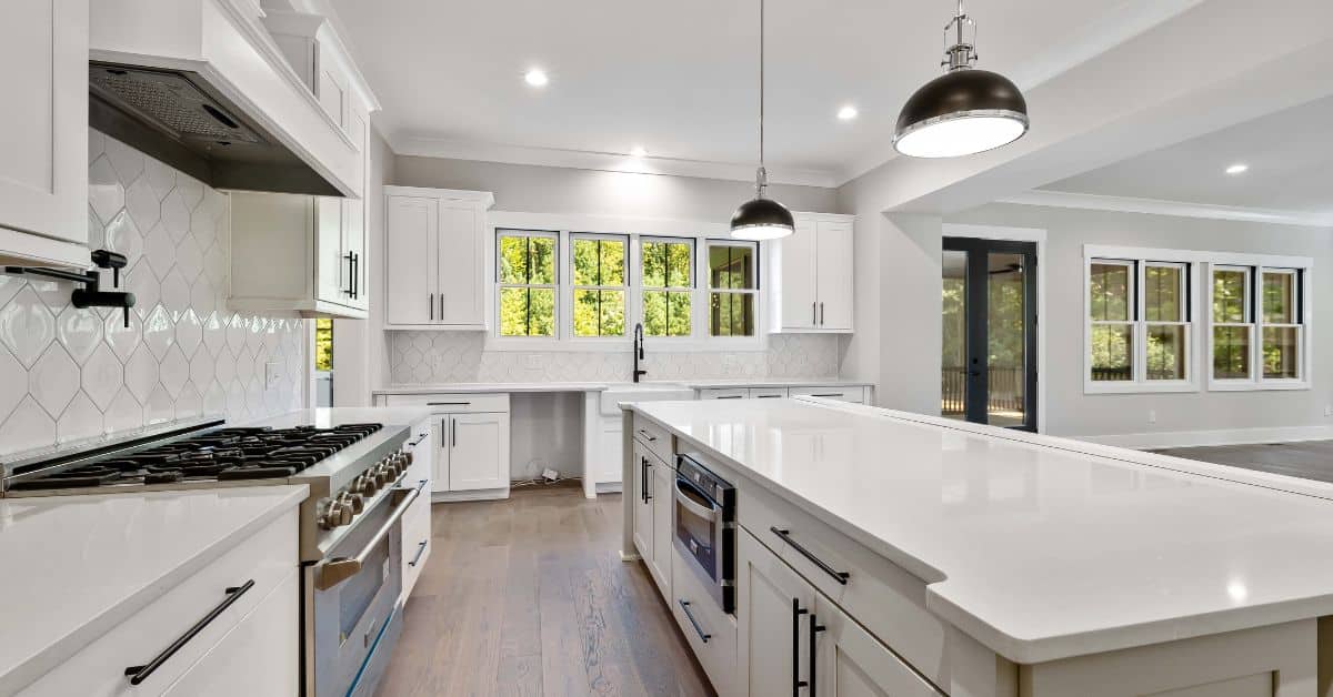 Modern kitchen with sleek white cabinetry and spacious countertops in South Africa.