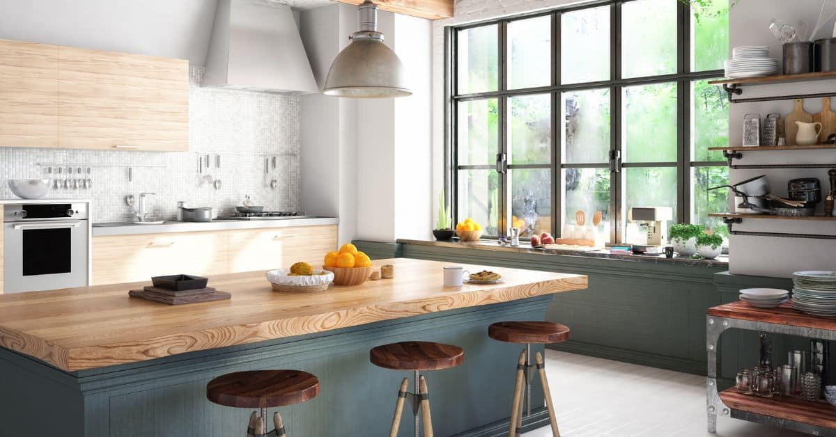 Contemporary kitchen design with wooden countertops and ample natural light from large windows.