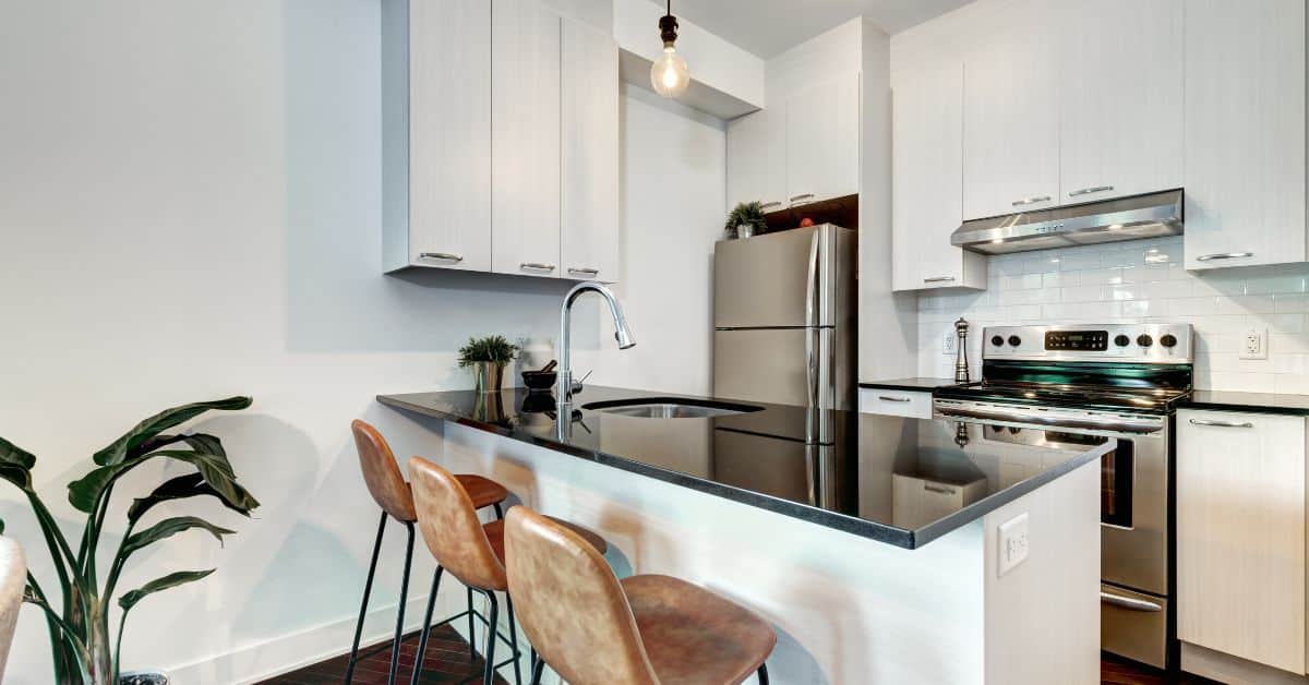 Contemporary South African kitchen with sleek white cabinetry and modern appliances.