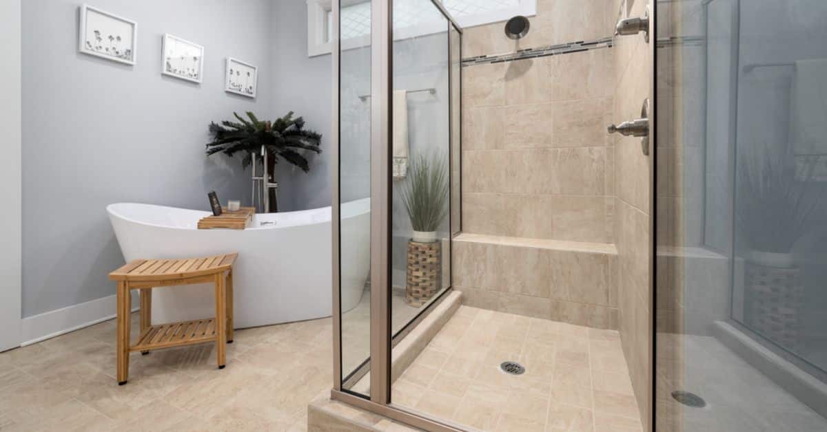 Elegant shower enclosure with glass doors in a contemporary bathroom setting.