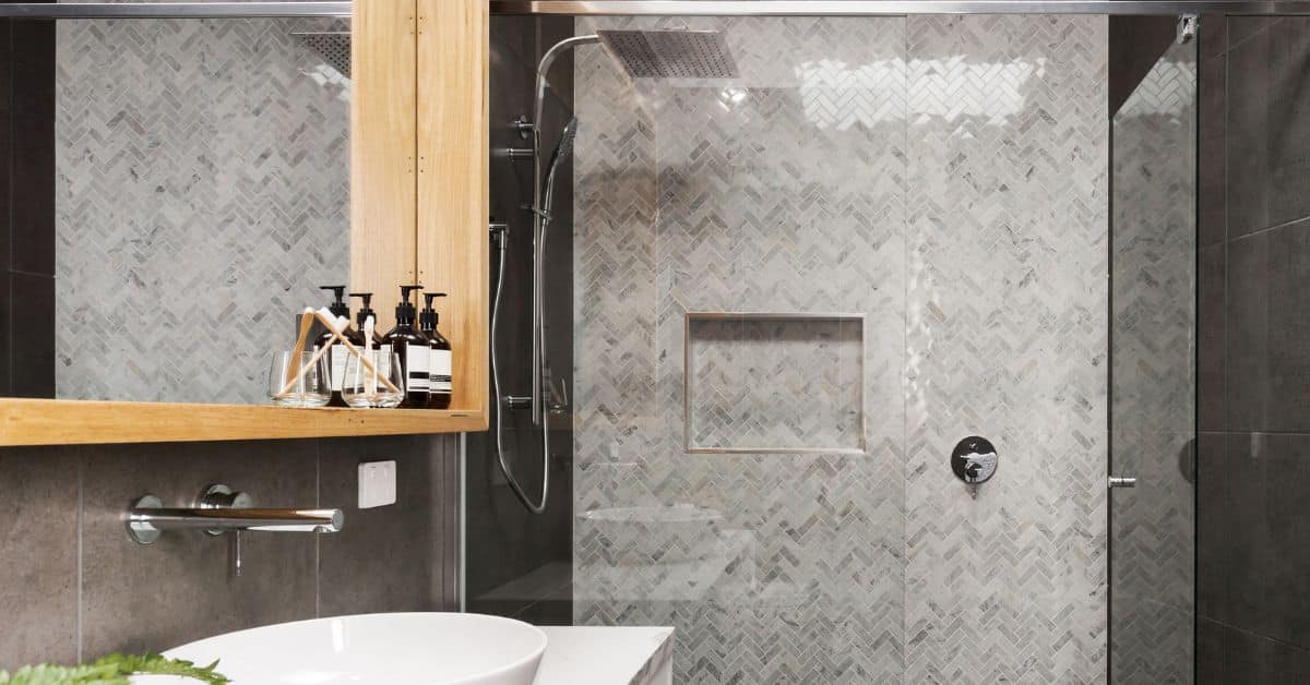 Stylish modern shower with sleek glass enclosure and contemporary tile design.
