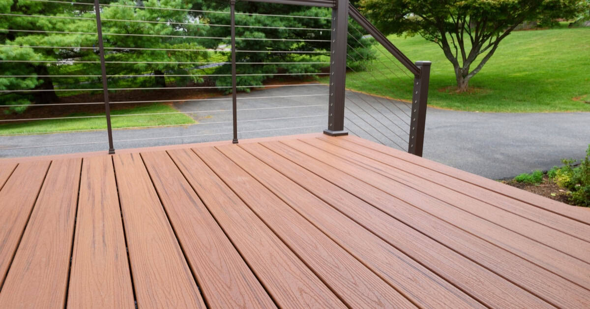 Modern composite decking on a patio with railing, ideal for durable outdoor spaces in South Africa.