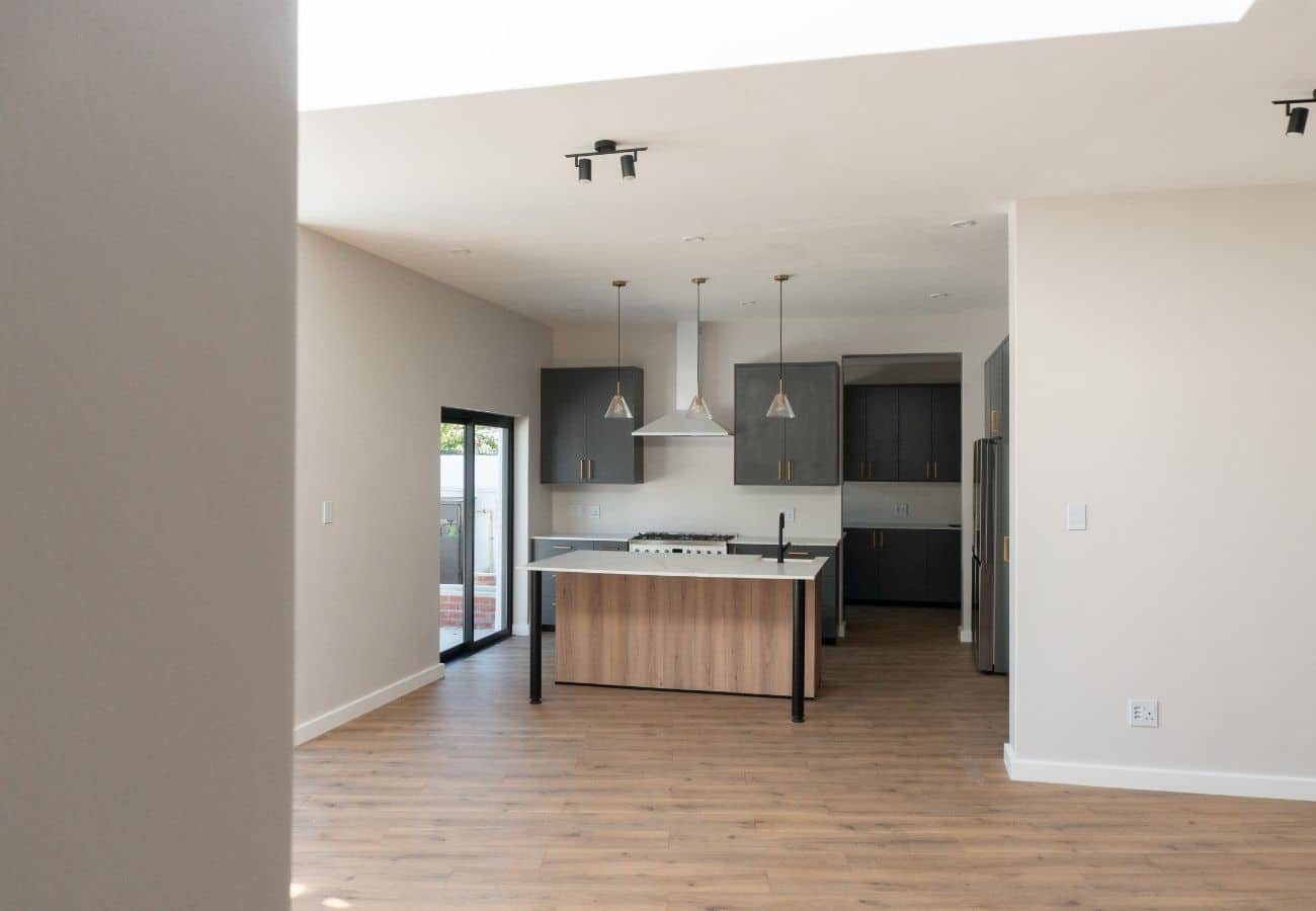 Kitchen with island, pendant lighting, and sleek cabinetry.
