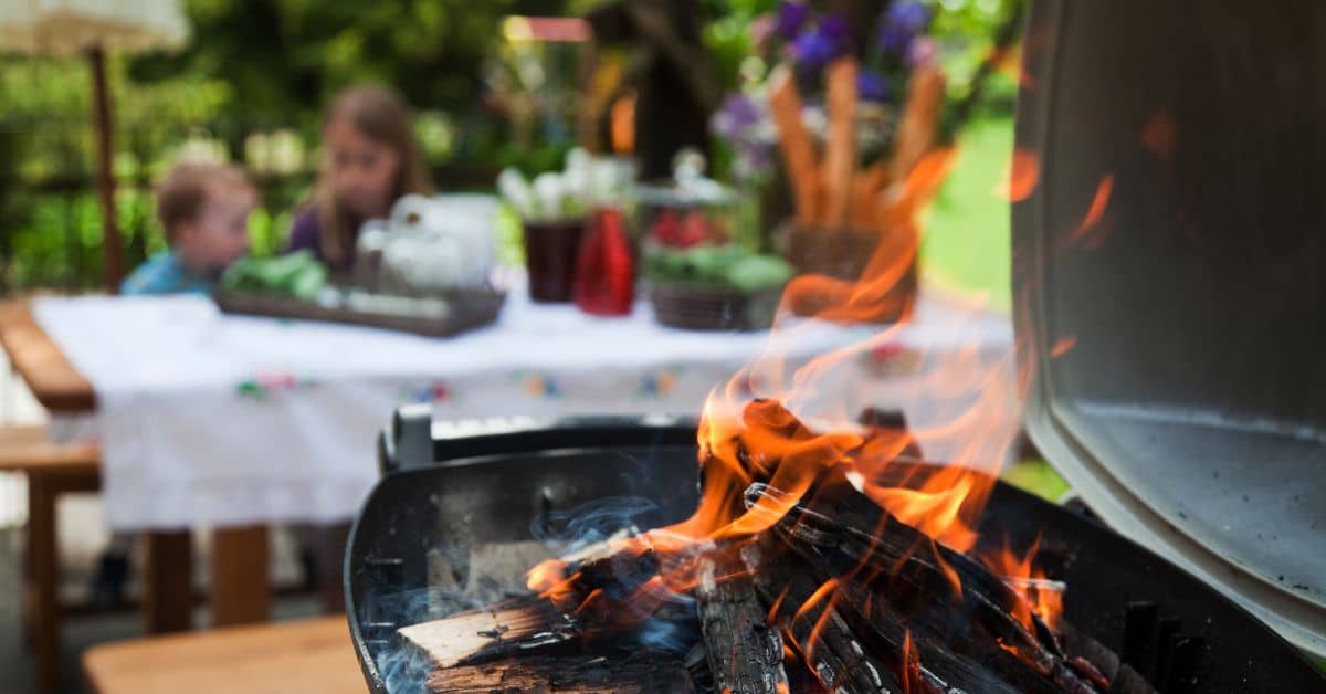 Cozy outdoor grilling area with fire pit for entertaining guests.