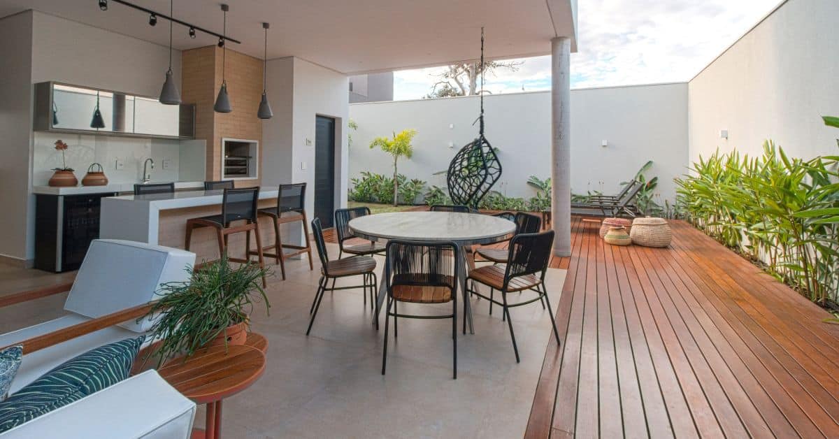 Modern outdoor entertainment space with dining and lounge areas, perfect for gatherings and outdoor.