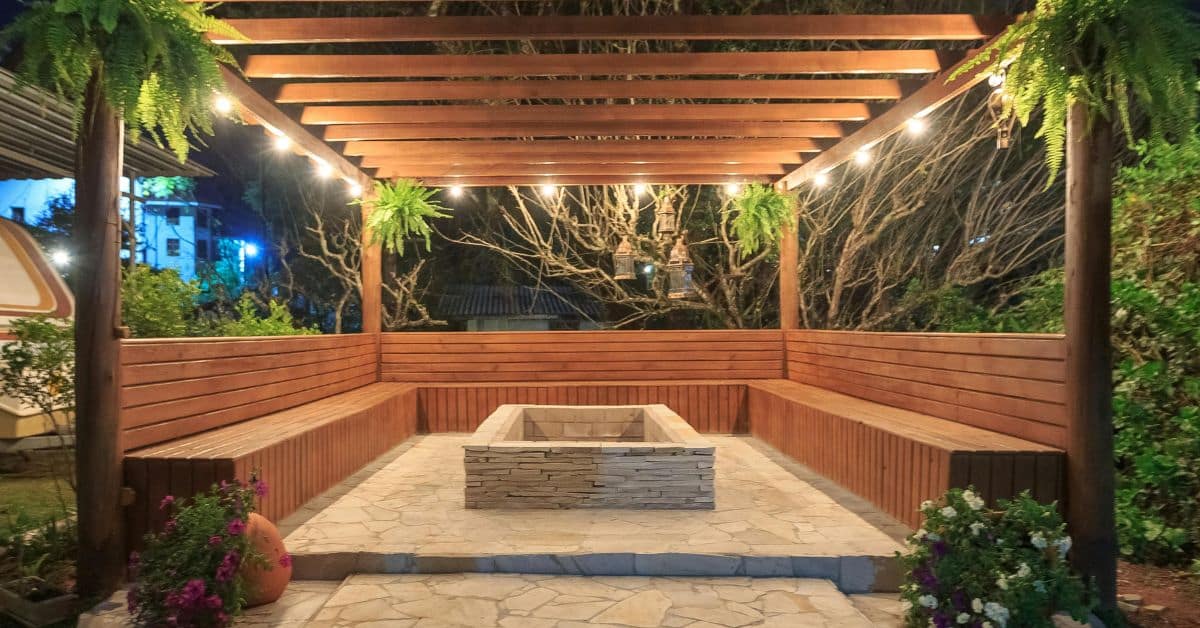 Beautiful outdoor entertainment space with wooden seating and fire pit for gatherings and leisure.
