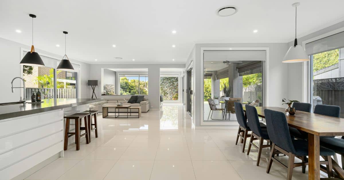 Spacious open plan kitchen and lounge with modern design and natural light.