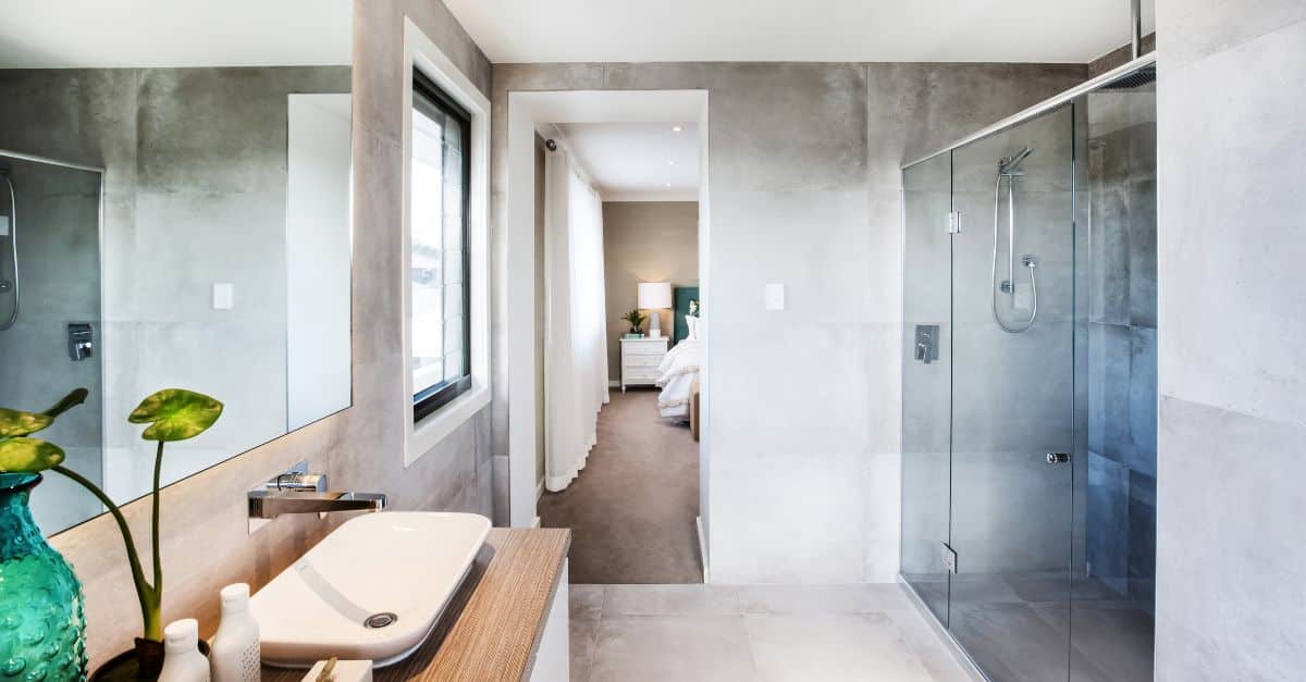Bright, contemporary bathroom featuring a walk-in shower, large window, and minimalist design. Perfe.
